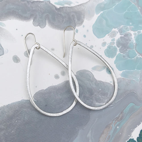 Silver tear drop hoop earring